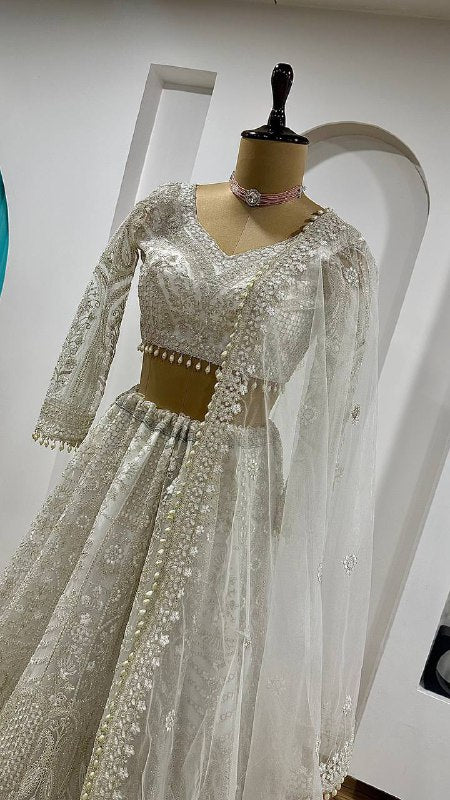 Elegant White Net Lehenga with Unstitched Blouse And Pearl Dupatta
