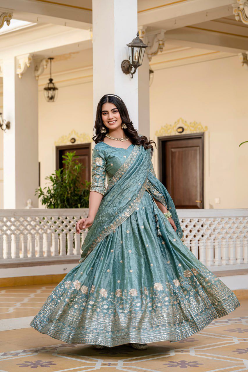 beautiful teal or dusty blue Indian lehenga with gold embroidery