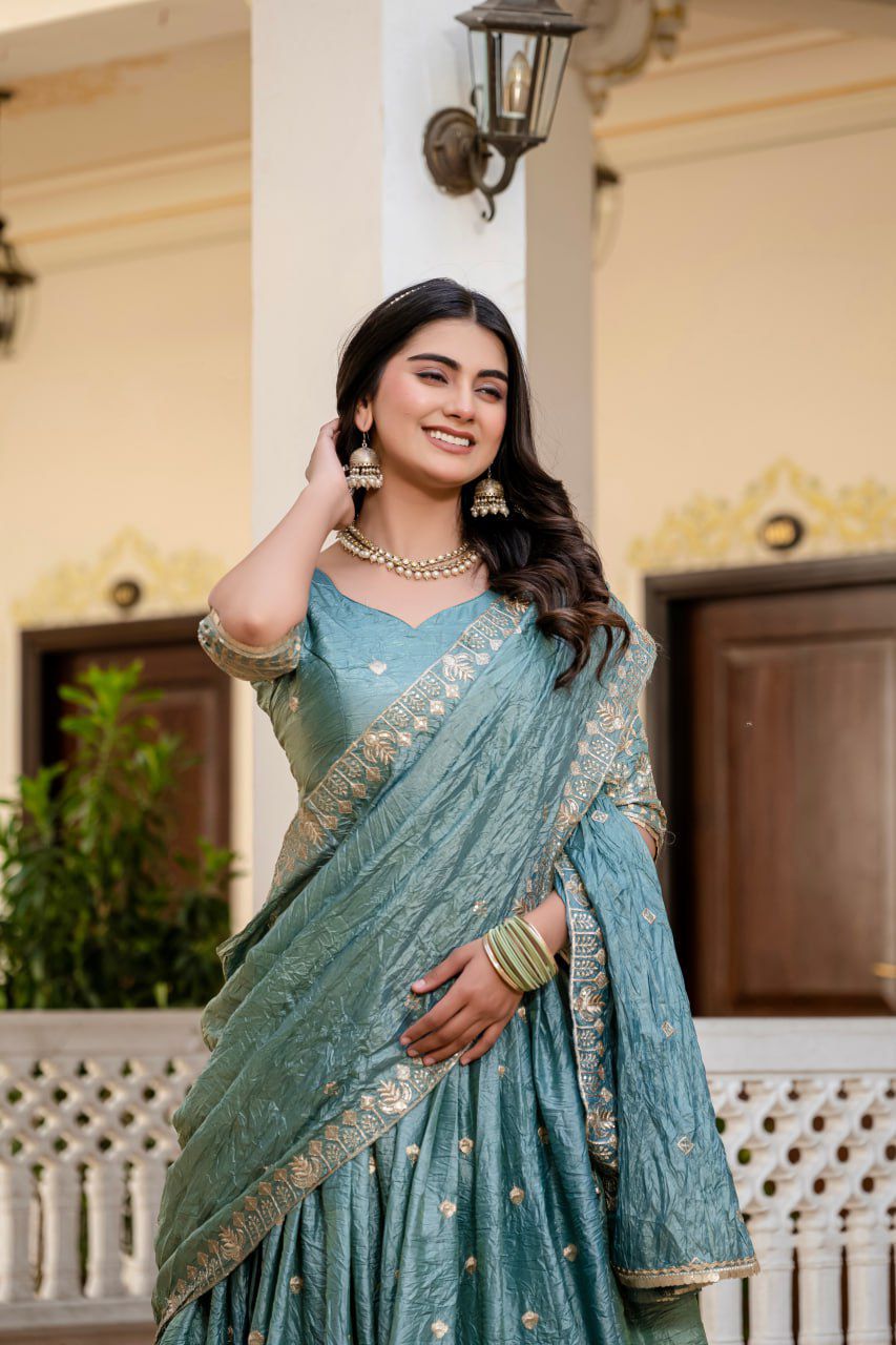 beautiful teal or dusty blue Indian lehenga with gold embroidery