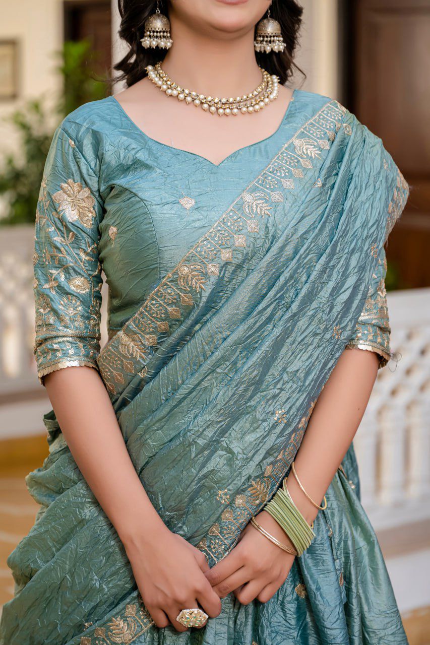 beautiful teal or dusty blue Indian lehenga with gold embroidery