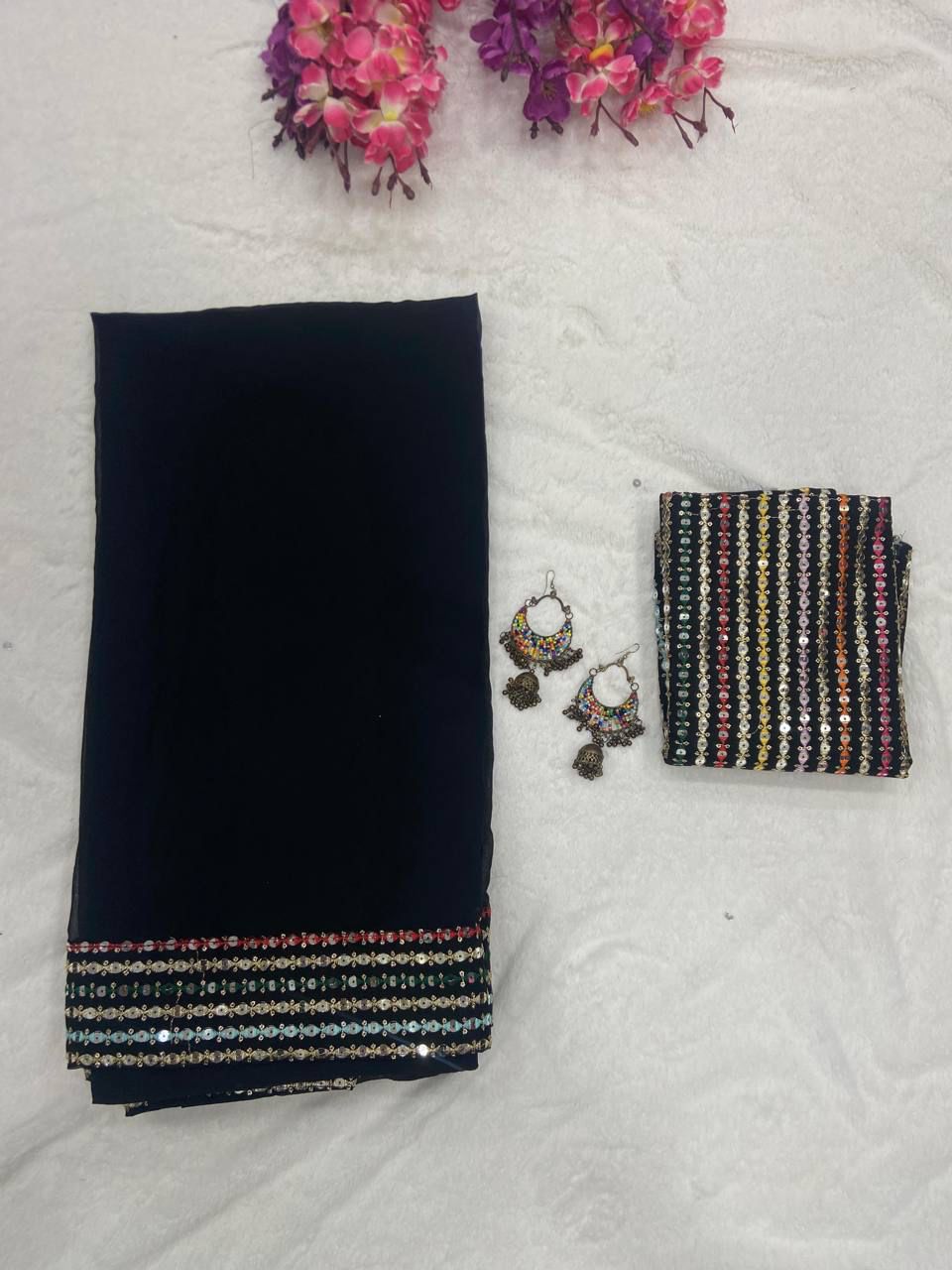 Elegant Black Georgette Saree with Multi color Embroidered Blouse