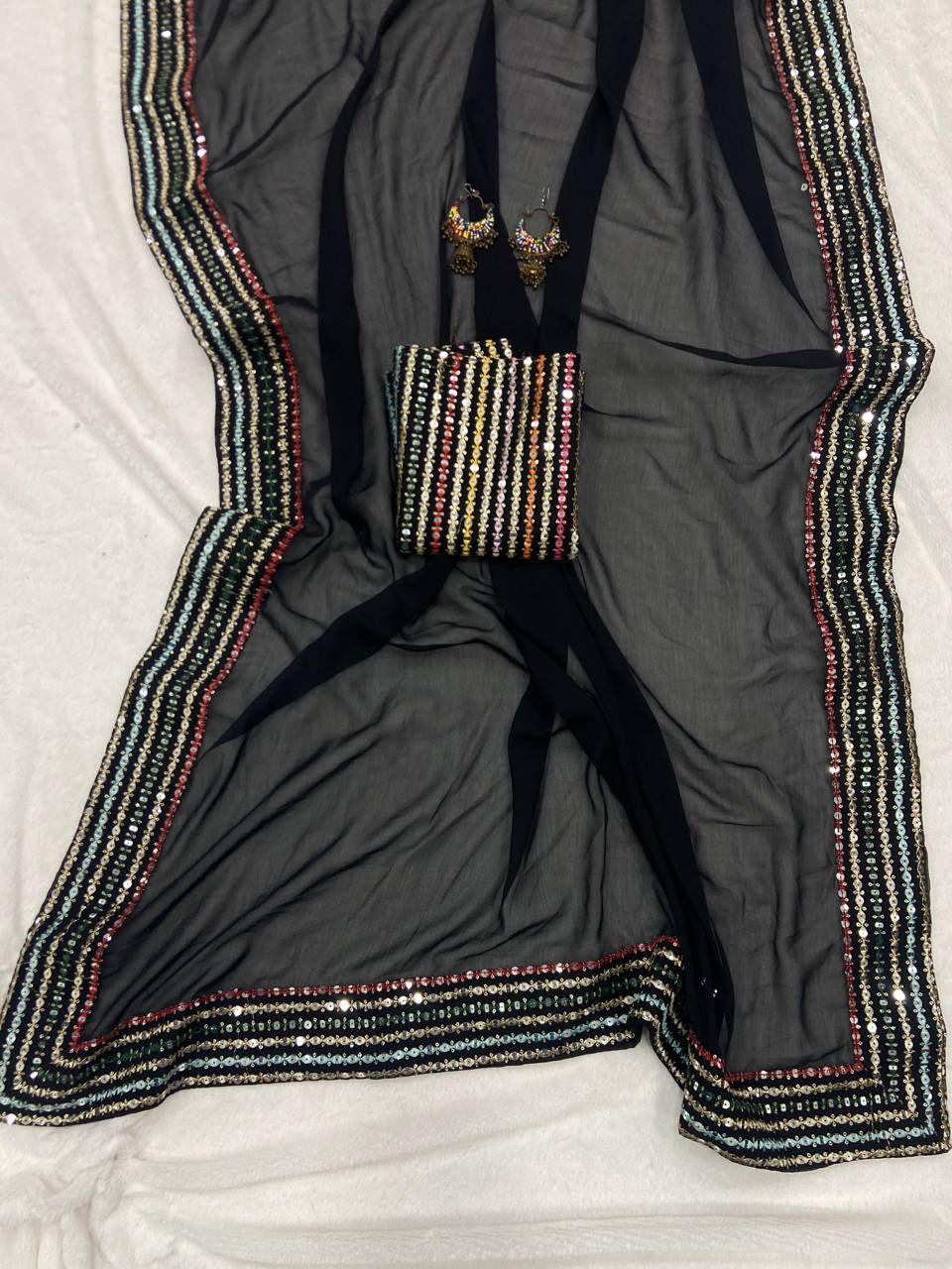 Elegant Black Georgette Saree with Multi color Embroidered Blouse