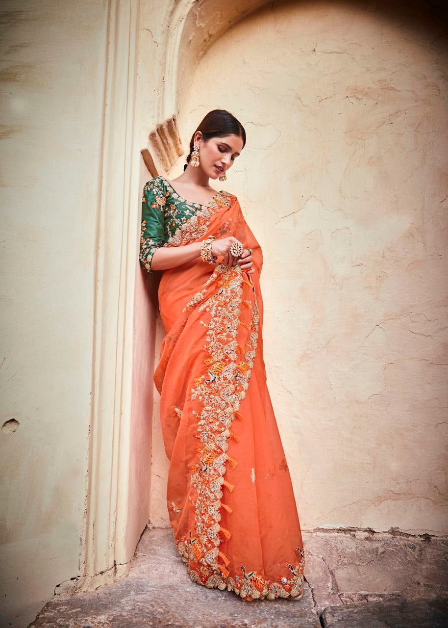 Stunning Orange Lightweight Saree with Detailed Thread Embroidery and Contrast Green Half-Sleeve Blouse