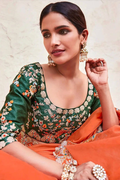 Stunning Orange Lightweight Saree with Detailed Thread Embroidery and Contrast Green Half-Sleeve Blouse