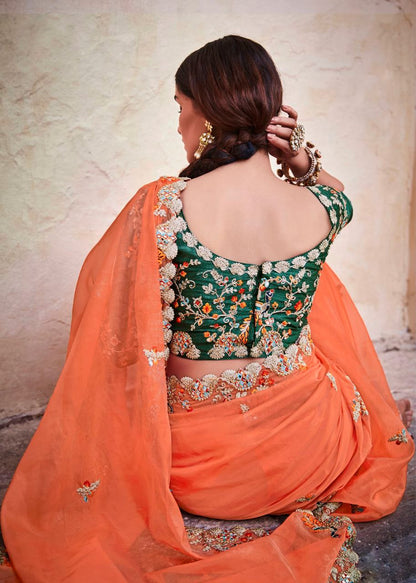 Stunning Orange Lightweight Saree with Detailed Thread Embroidery and Contrast Green Half-Sleeve Blouse