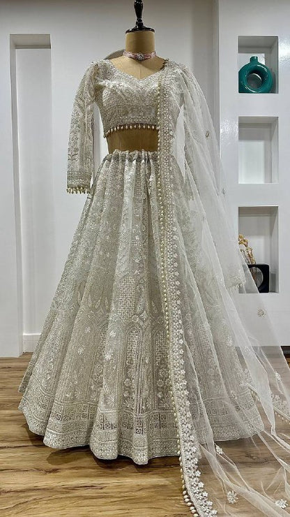 Elegant White Net Lehenga with Unstitched Blouse And Pearl Dupatta