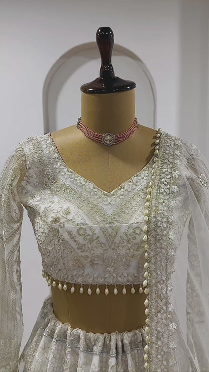 Elegant White Net Lehenga with Unstitched Blouse And Pearl Dupatta