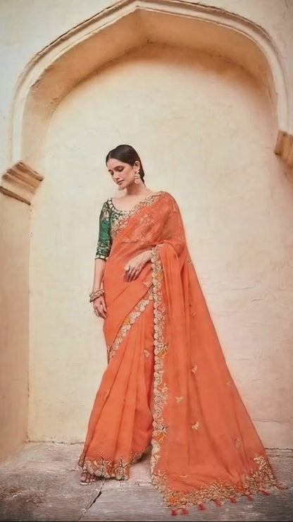 Stunning Orange Lightweight Saree with Detailed Thread Embroidery and Contrast Green Half-Sleeve Blouse